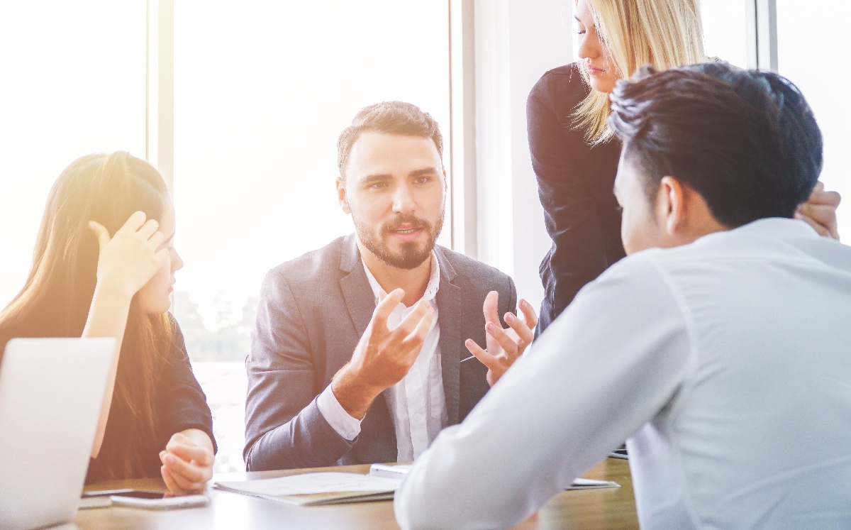 group of  business people chatting with each other